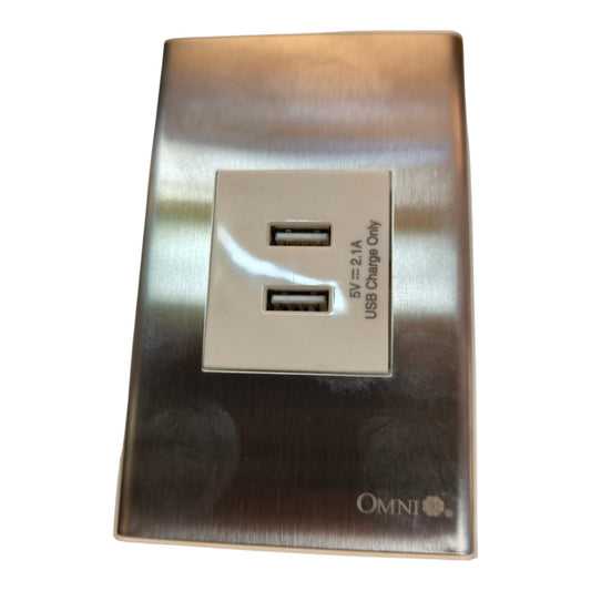 A brushed stainless steel wall charger plate featuring two USB-A ports on a raised central panel, with '5V=2.1A USB Charge Only' text and the Omni logo at the bottom.