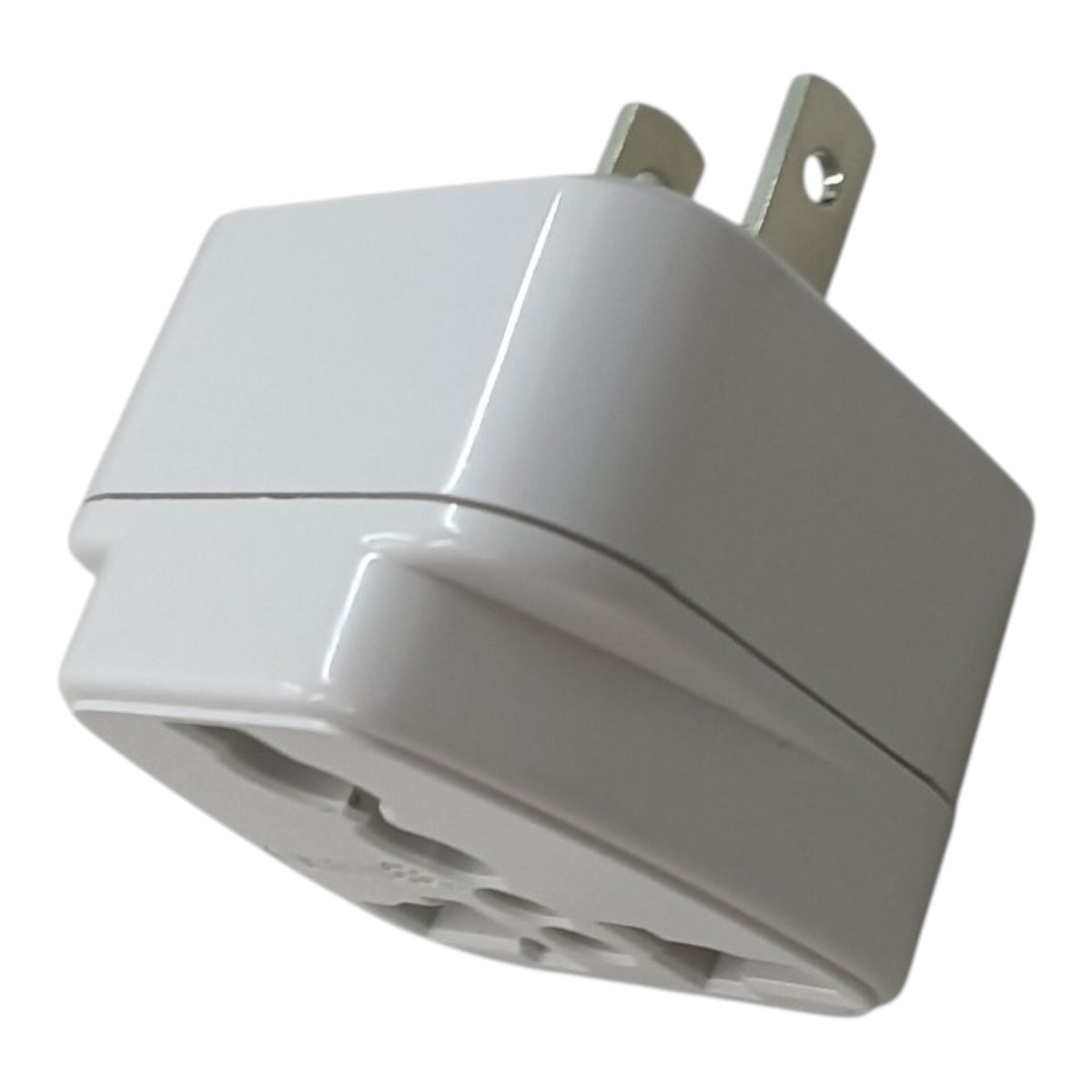 A white plastic multi-socket wall charger adapter with two metal flat prongs, shown on a plain white background.