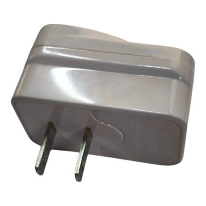 A gray plastic dual-plug wall charger adapter, photographed on a plain white background.