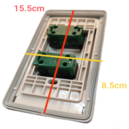 A two-gang wall switch plate backplate with two green terminal blocks, overlaid with red and yellow measurement lines and text indicating dimensions 15.5cm and 8.