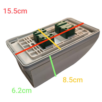 A gray plastic electrical junction box or terminal block with green terminal connectors on top, shown on a white background with red, yellow, green, and orange dimension lines and text labels indicating 15.5cm, 8.