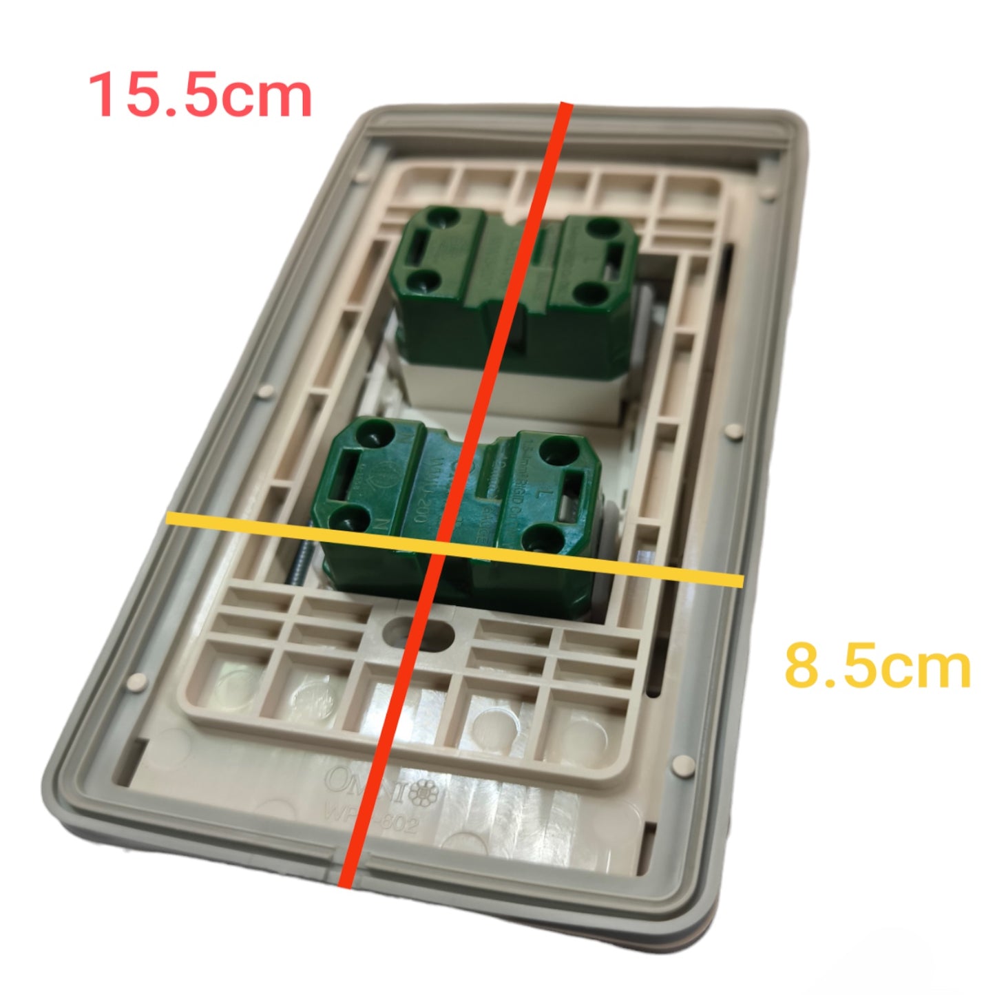 A two-gang wall switch plate module with green terminal blocks on a gray backplate, overlaid with red and yellow dimension lines and text indicating 15.5cm and 8.