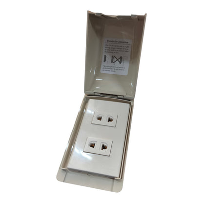 A double electrical outlet covered by a beige protective plastic shell, shown open against a plain white background.