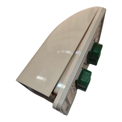 A beige plastic wall-mounted light fixture with two green push-button switches, shown at an angle on a white background.