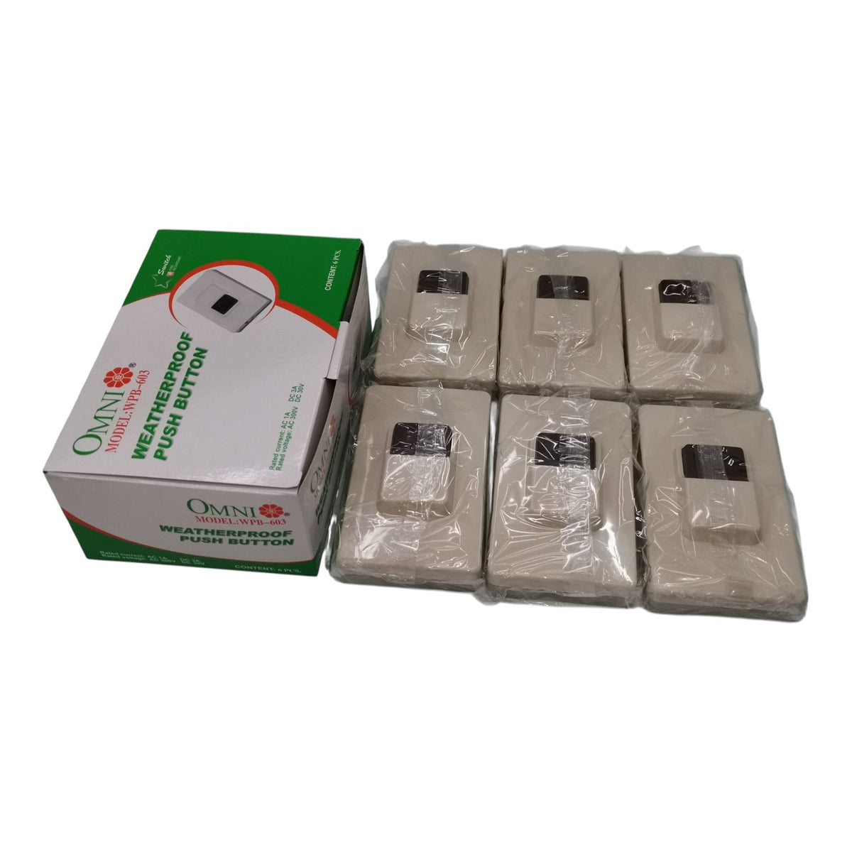 Six packaged Omni Weatherproof Push Buttons next to their green and white retail box on a white background.