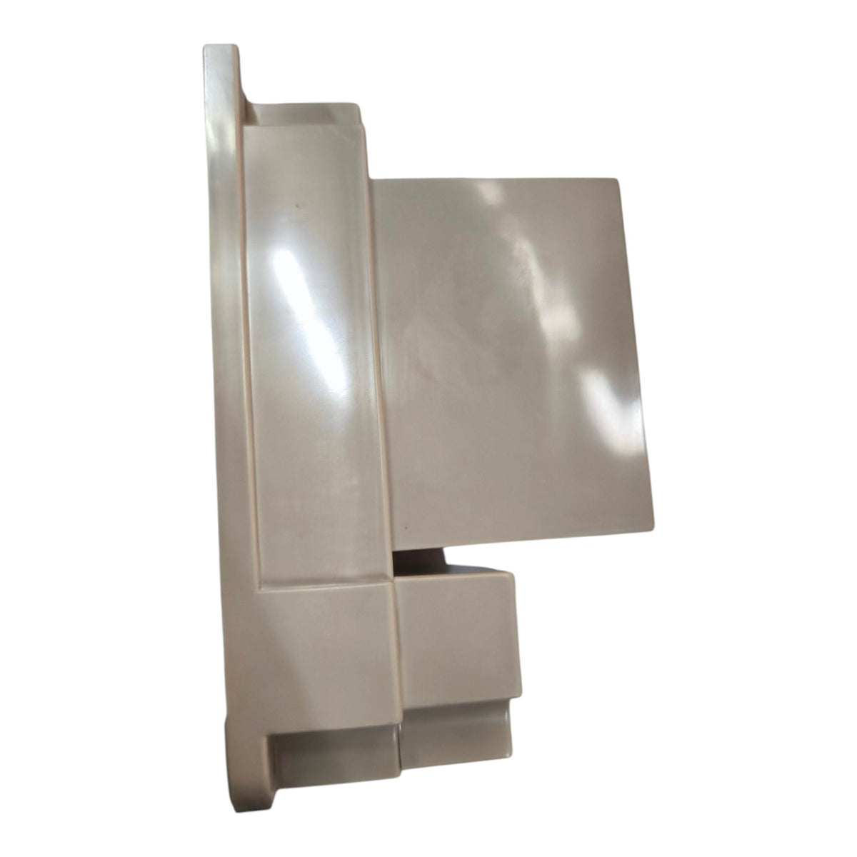 A beige plastic appliance part, likely a drawer front or handle assembly, shown from a side profile view against a white background.