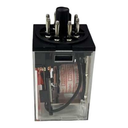 A small electrical relay component with a black top housing metal terminals, a clear plastic side enclosure, and visible internal wiring and red printed labels, shown on a plain white background.
