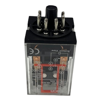 A black and clear plastic electrical relay component with multiple metal terminal pins on top, photographed against a plain white background.