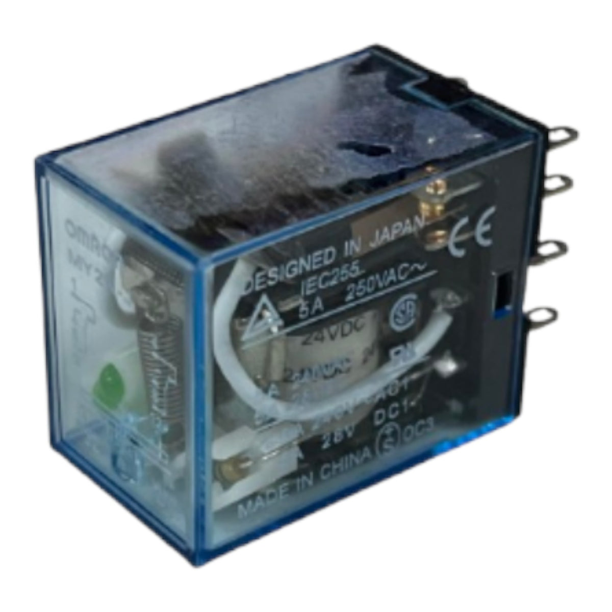 A blue plastic-relay electrical component with visible internal coils and terminals, photographed on a plain white background. Printed markings include 'DESIGNED IN JAPAN', '6A 250VAC~', 'CE', and 'MADE IN CHINA'.