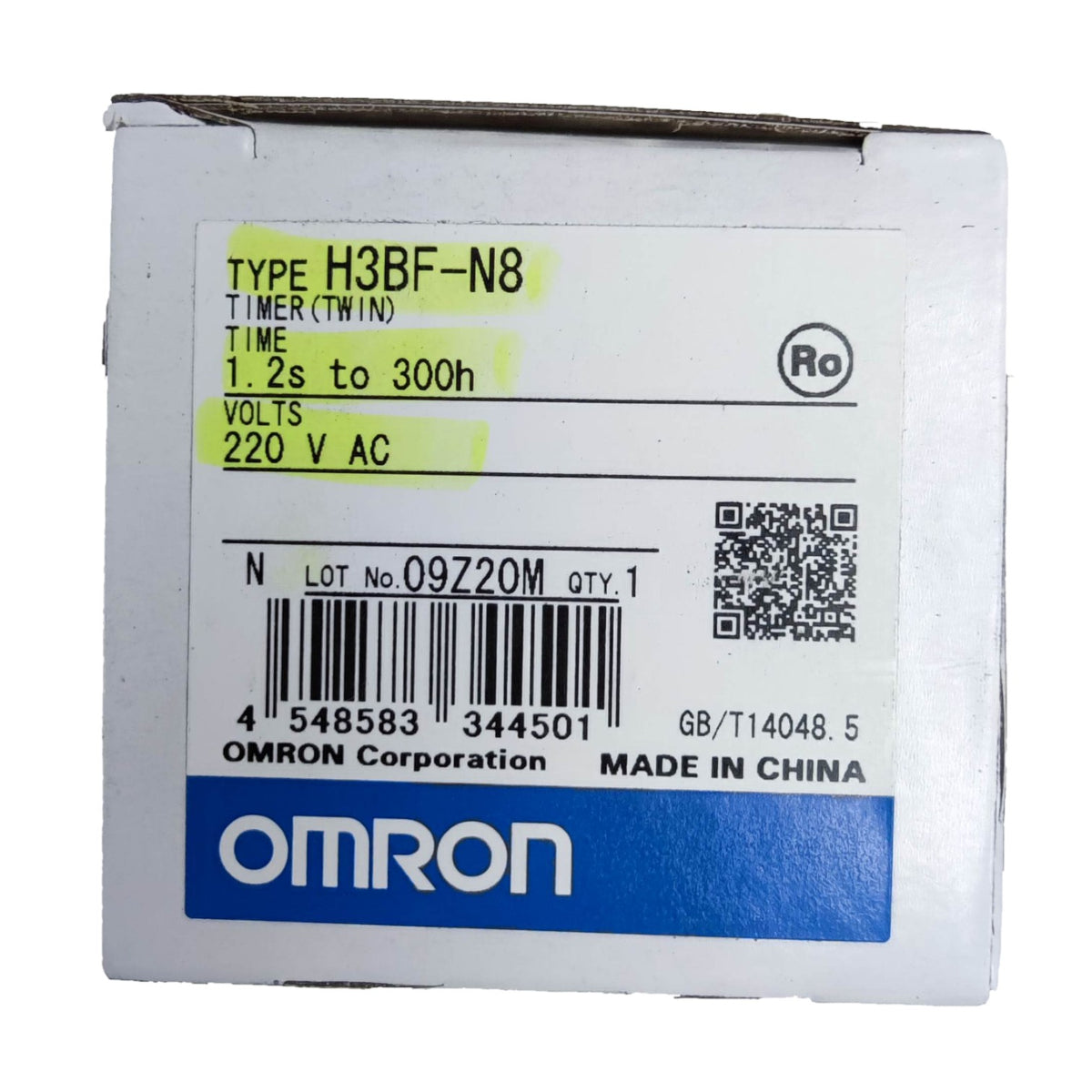 A square Omron brand cardboard box with a white label, featuring a barcode, QR code, and a blue Omron logo at the bottom. A yellow highlight is drawn around the text specifying 'TYPE H3BF-N8 TIMER (TWIN)'.
