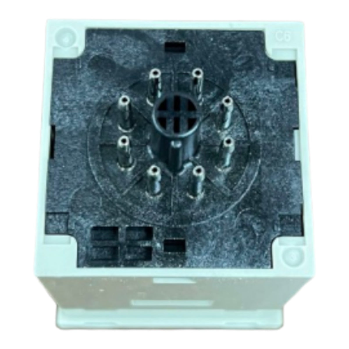 A square electrical connector component with a white plastic outer housing and a dark gray textured internal contact plate, shown against a plain white background.