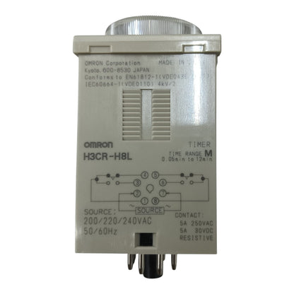 An Omron H3CR-H8L electrical timer relay unit with a gray plastic housing, silver metal top and bottom terminals, and printed technical specifications and wiring diagrams on the front.