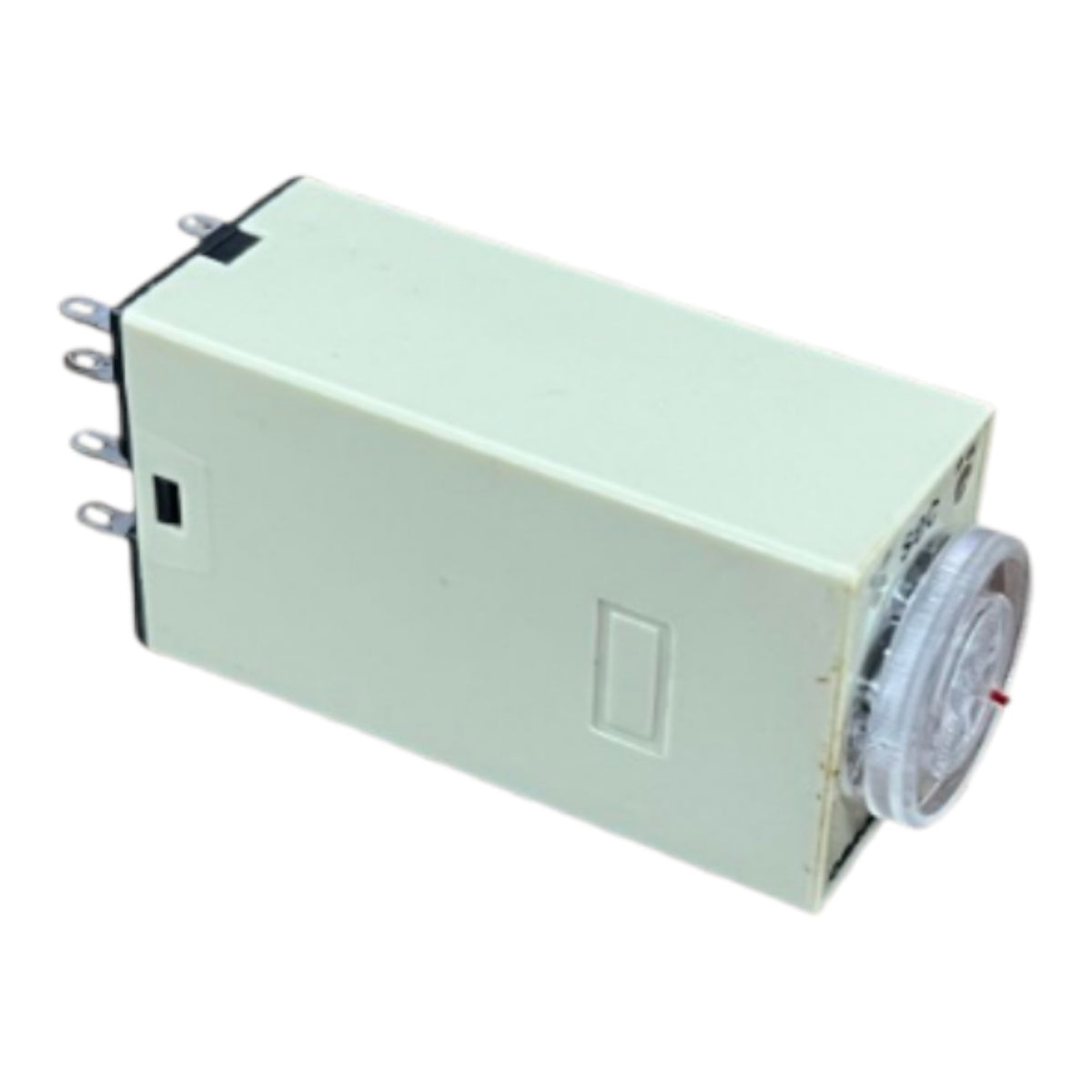 A rectangular light green electrical timer relay with metal terminal leads on one end and a clear plastic dial window on the other, shown against a plain white background.