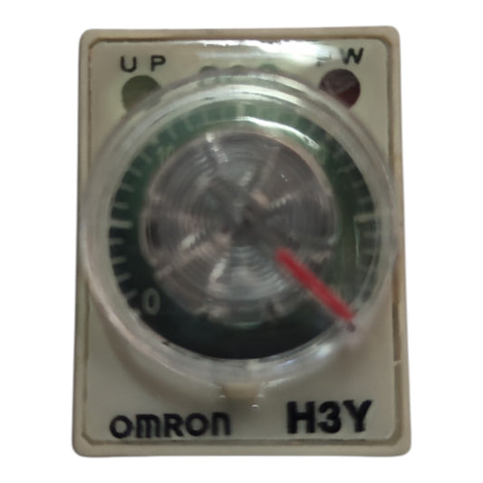An Omron H3Y analog timer switch with a beige plastic housing, featuring a clear protective cover over a green and black dial with a red pointer, on a white background.