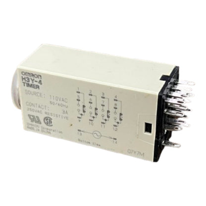 An Omron H3-Y-4 Timer electrical relay module with a beige plastic housing, printed technical specifications and pin diagrams, and a black terminal block with multiple metal contacts on the right side.