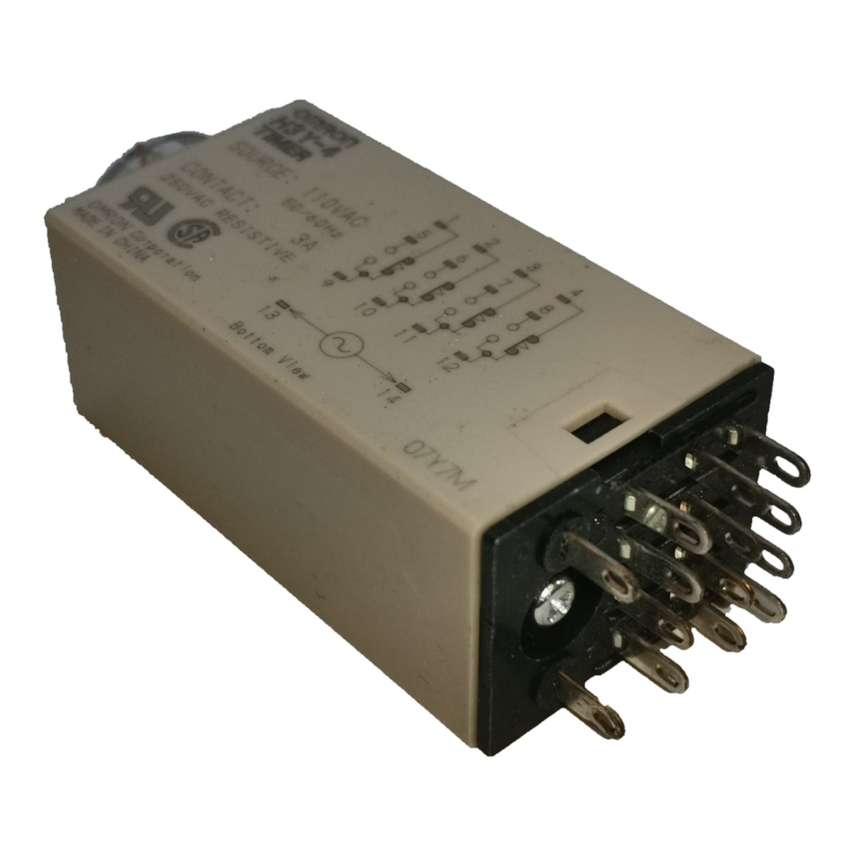 An industrial electrical contactor relay with a beige metal housing, black terminal base, and multiple metal contact pins on one end, shown on a plain white background.