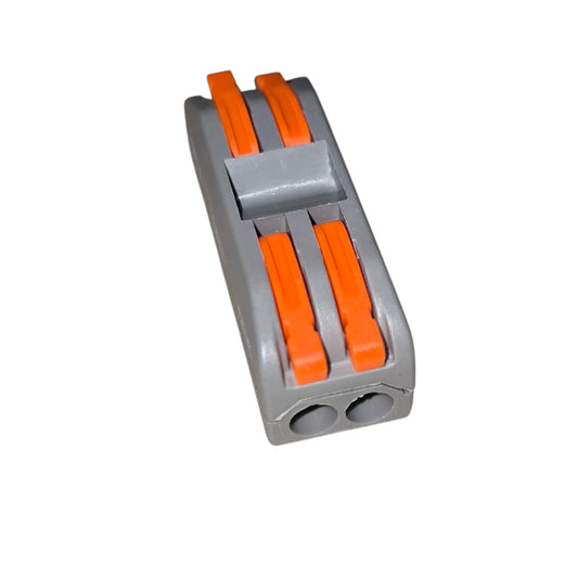 Gray plastic block with orange connectors on a white background