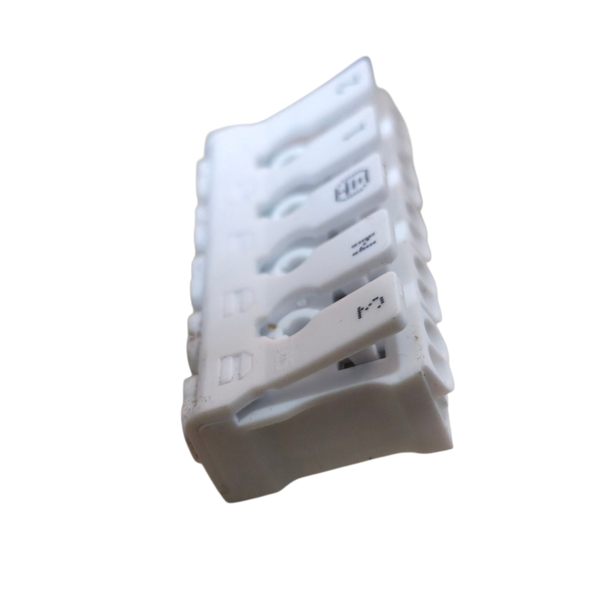 Stack of white plastic components on a white background