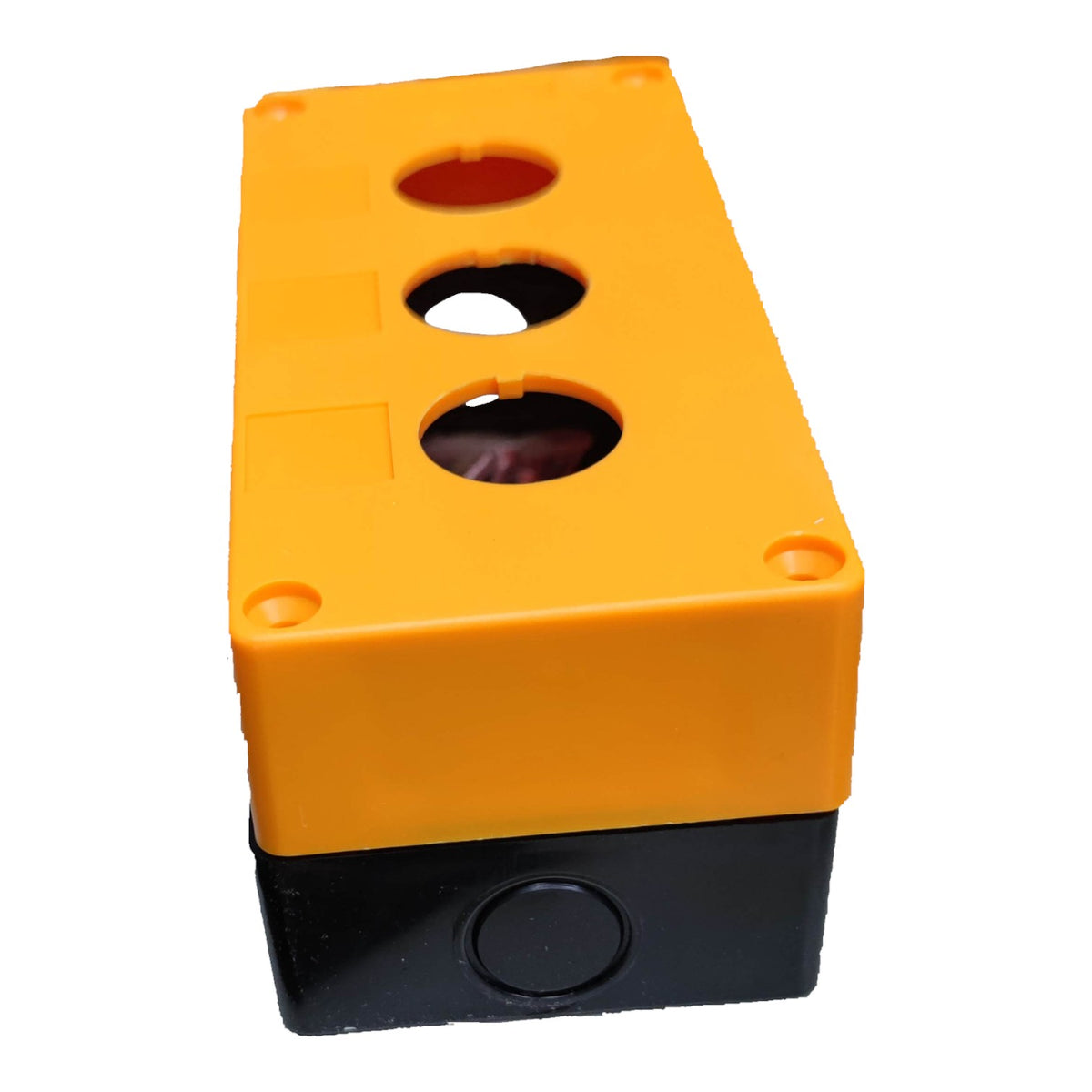 A plastic junction box with a bright orange top cover and a black base, featuring three circular openings on top and a round button on the front of the black base, isolated on a white background.