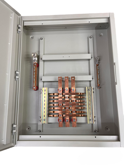 Open gray metal electrical cabinet showing internal busbar system with copper-colored conductors, terminal bars, and mounting brackets.