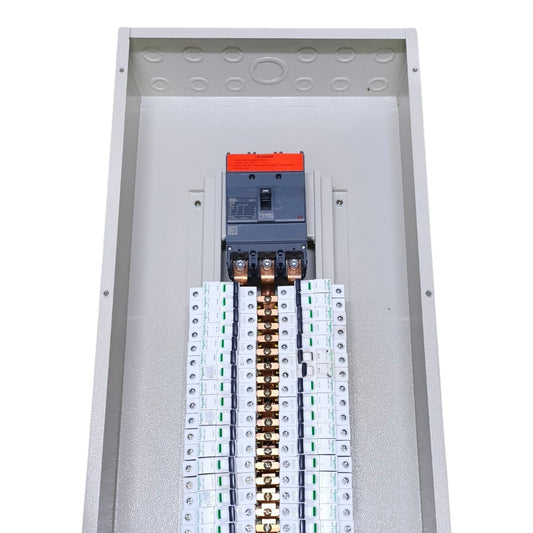 An open metal electrical panel showing a circuit breaker and multiple terminal blocks with copper-colored bus bars, photographed on a plain white background.