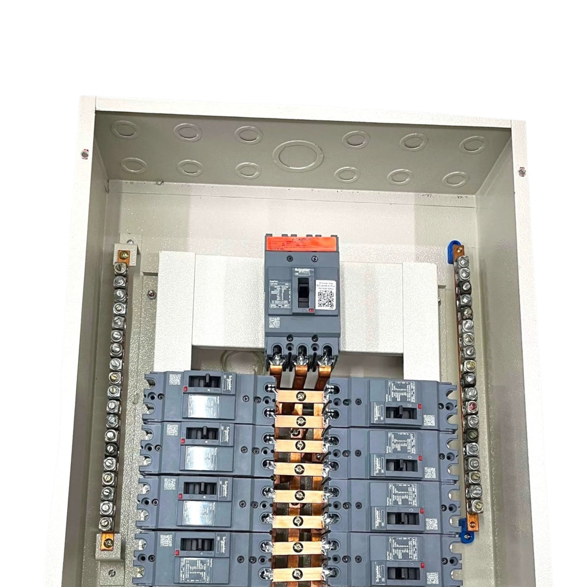 An open electrical distribution panel showing multiple gray circuit breakers arranged in rows, with copper bus bars connecting them and terminal blocks on both sides, photographed against a white background.
