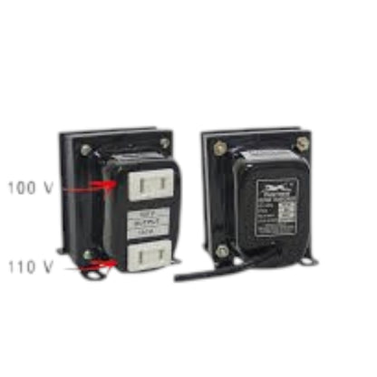 Two black electrical transformers shown side by side on a white background, with red arrows and text indicating 100 V and 110 V input voltages. The left transformer shows the front with white terminal blocks, and the right transformer shows the back with a printed label and wire lead.