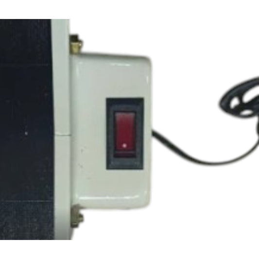A close-up of a white electrical junction box with a red rocker switch, attached to a dark panel, with a black power cord visible on a white background.