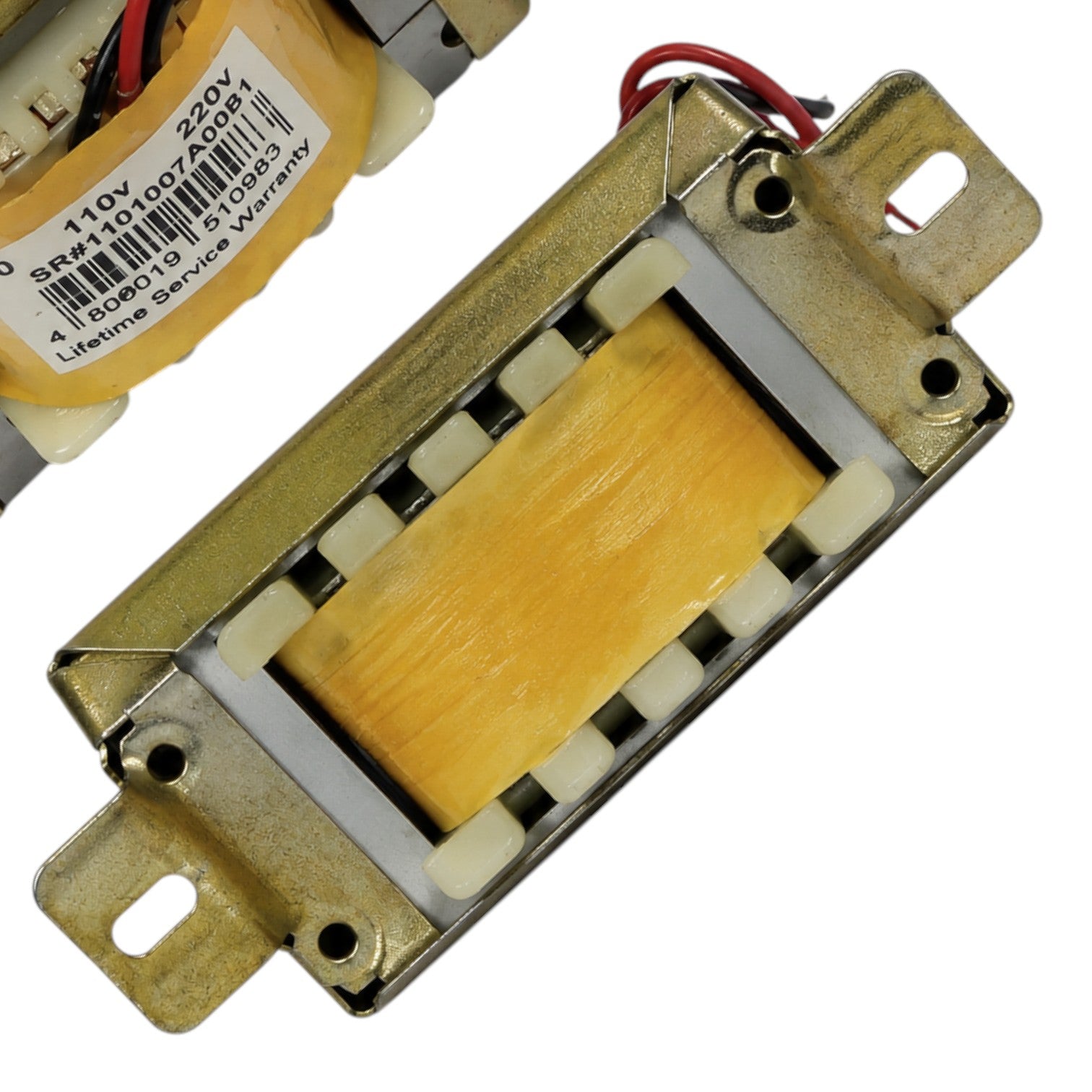 A close-up of a rectangular gold-toned metal electronic component with a yellow center section and attached red and black wires, shown on a white background with part of another similar component visible in the upper left.