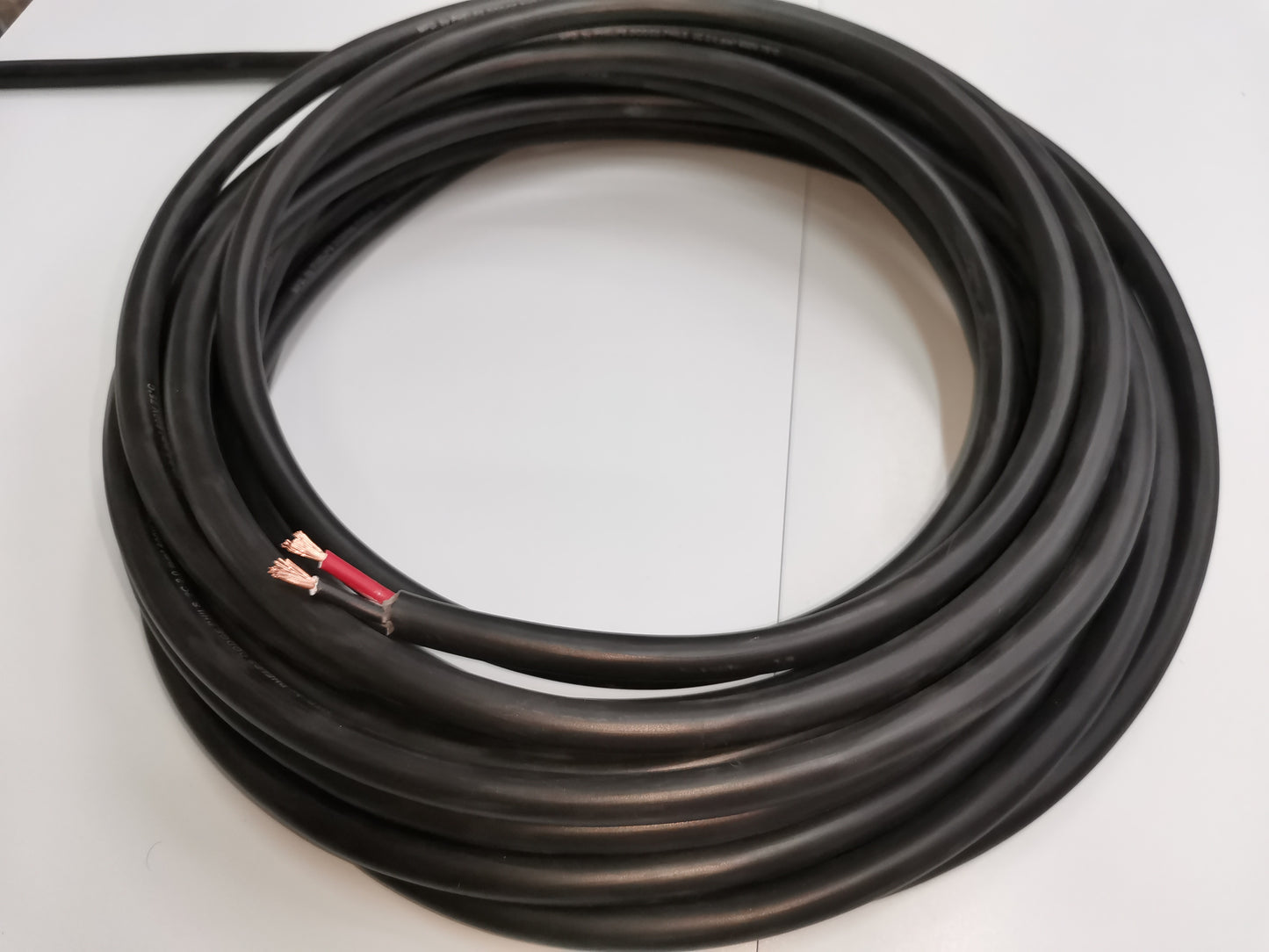 Phelps Dodge Royal Cord Cable AWG 12 2C in a coiled design for electrical wiring applications