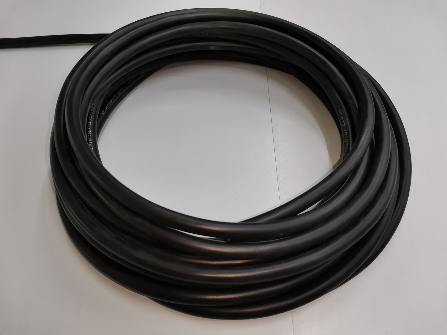 Royal Cord Cable AWG 12 2C in a coiled black wire roll for electrical connections