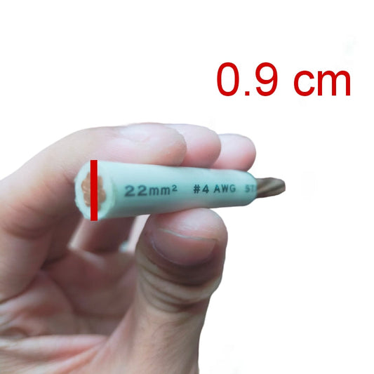 A hand holding a small white insulated wire lead with printed text '22mm² #4 AWG ST', a red measurement marker on the left, and red text reading '0.9 cm' on a white background.