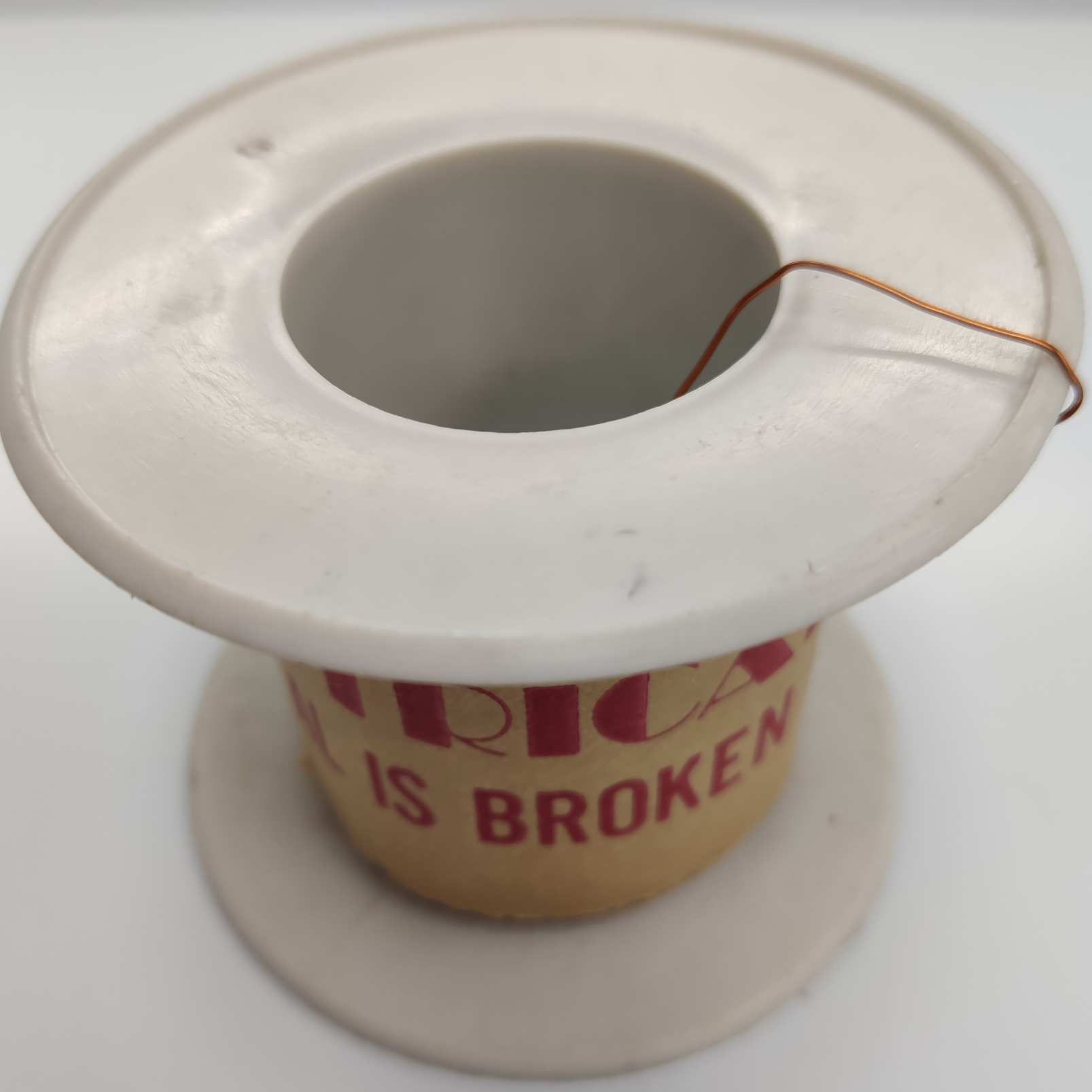 Philflex AWG 36 Magnetic Wire - 500G on a spool with a broken label for easy crafting and electrical projects