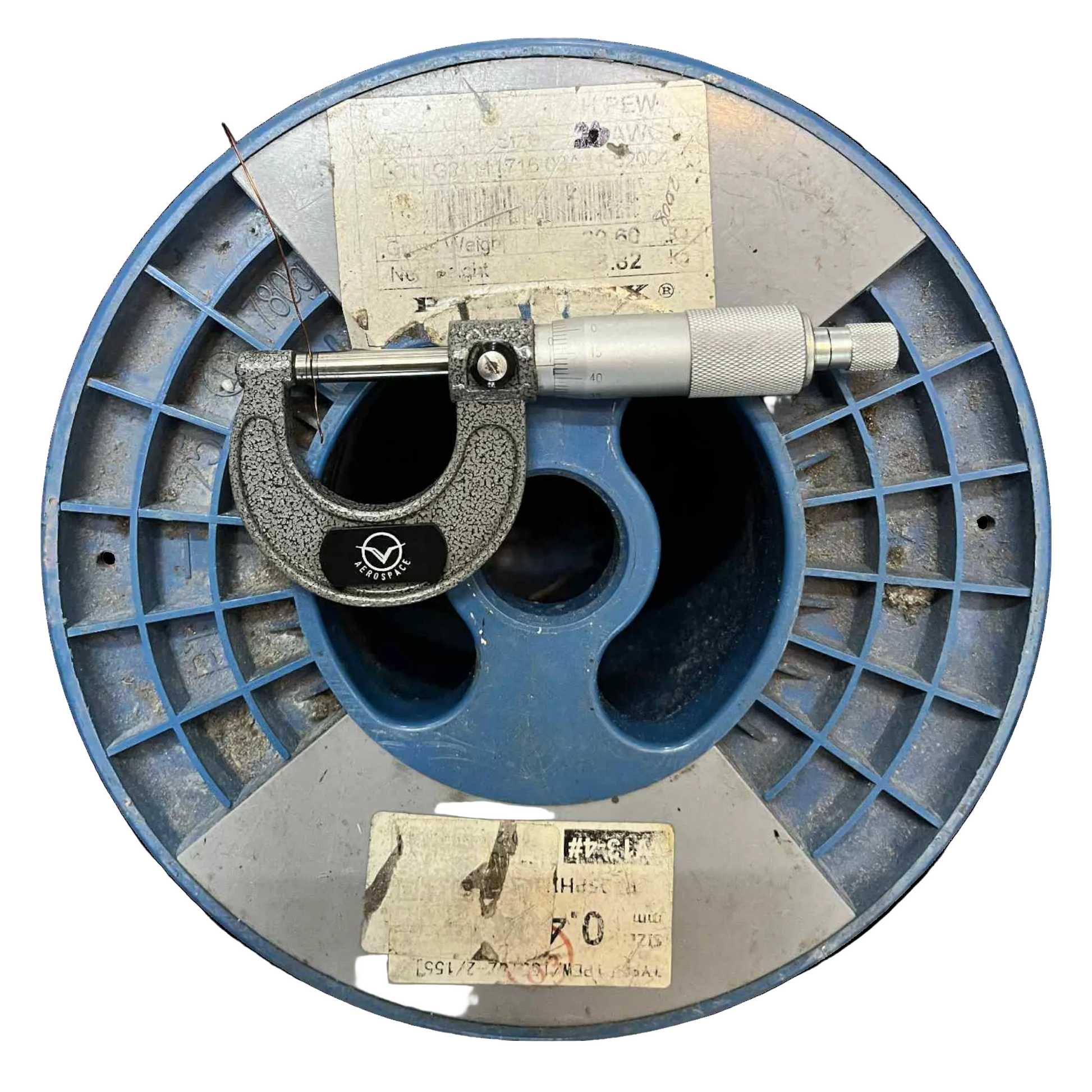 Micrometer on a blue metal spool with labels Philflex 600 Grams Magnet Wire AWG 26 Enameled Copper Wire 0.40mm Heavy Formix Approx 495.87 Meters Per Roll Electx Electrical Supply