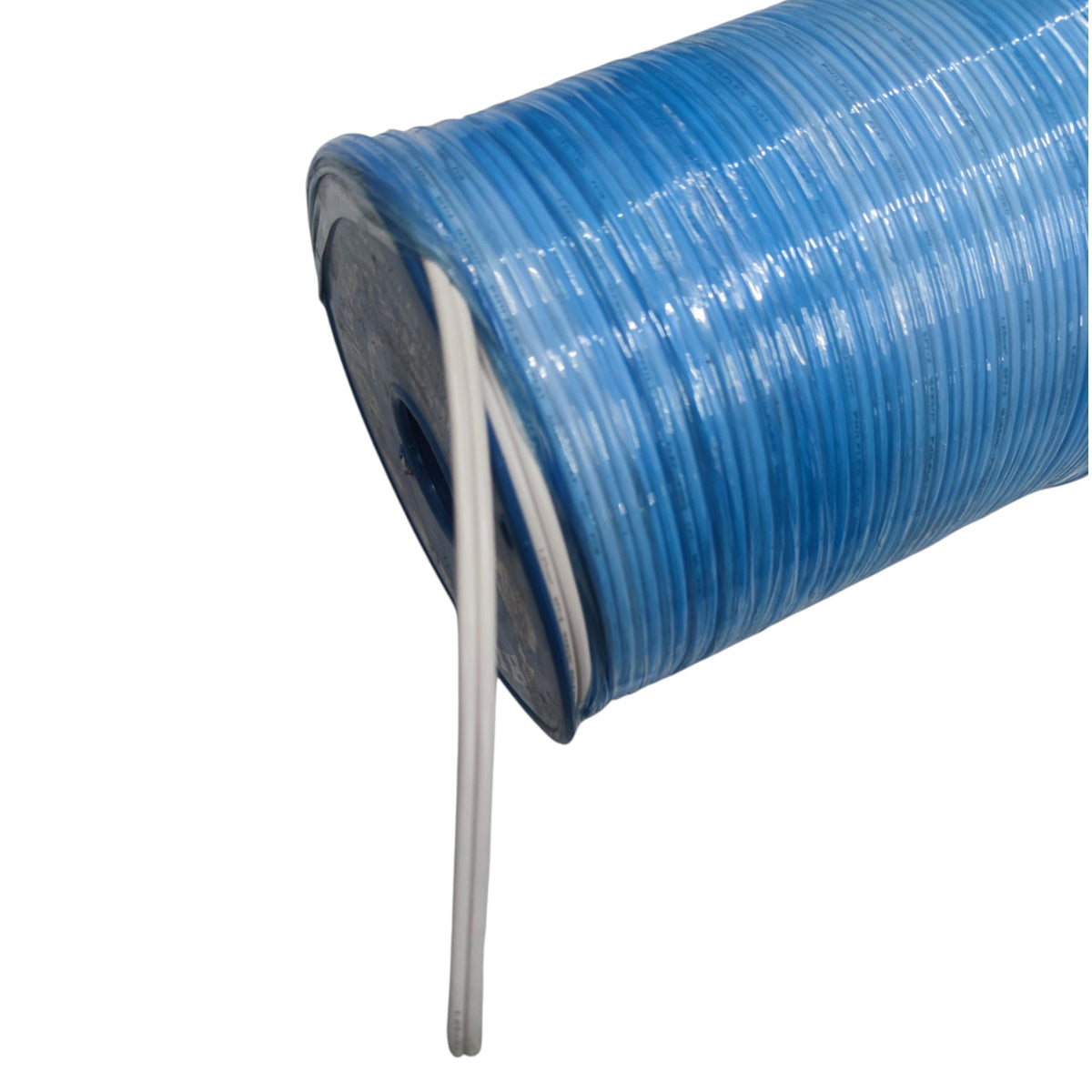 A close-up of a spool of translucent blue cord or wire, with a single strand unwinding vertically against a plain white background.