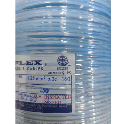 A close-up of a spool of light blue flat cable with a white and blue label showing product details and certification marks.