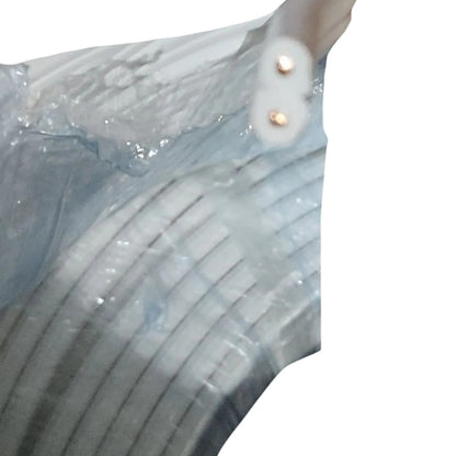 A close-up of a translucent light blue striped garment or fabric with two small metallic gold buttons on a white background.