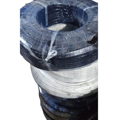 A stack of large industrial wire reels or spools wrapped in clear plastic, with the top reel showing a dark blue-black outer layer and a white inner layer, photographed against a plain white background.