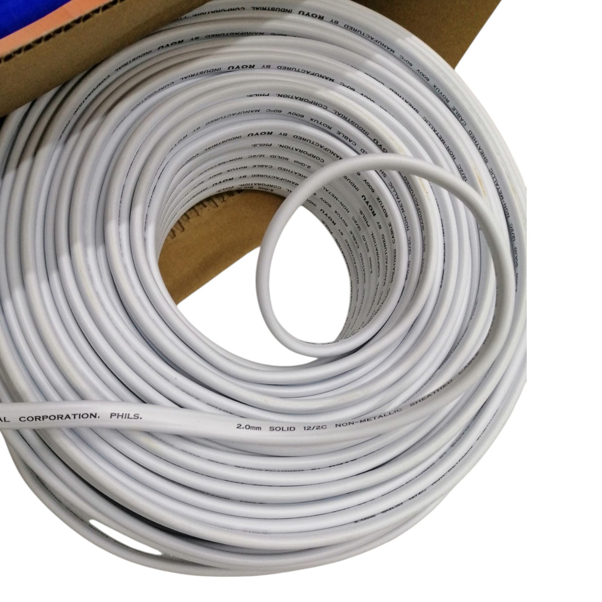A coiled roll of white solid non-metallic cable, partially unrolled to show the printed text specifications on the surface, set against a white background with a cardboard box edge visible.