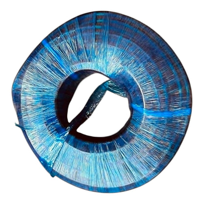 Close-up of a blue thread spool on a white background