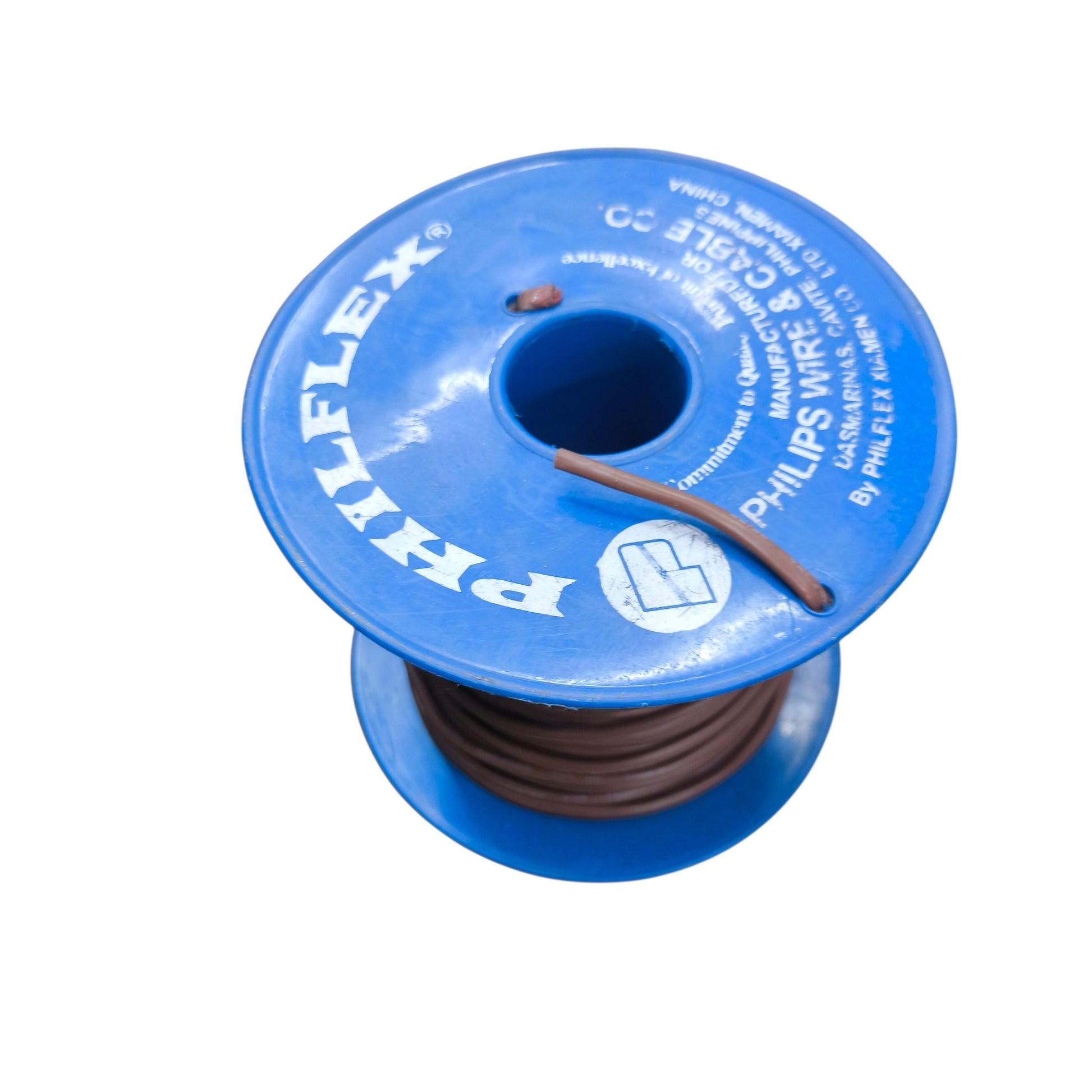 Spool of Philips wire with blue cap on a white background