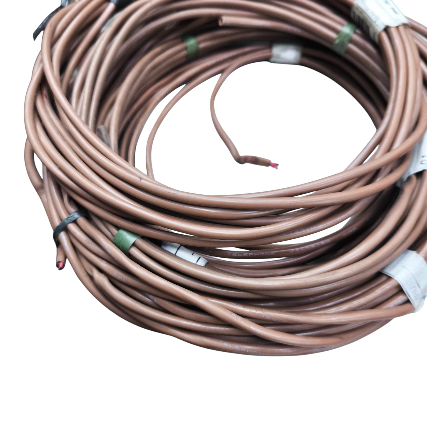 Coiled brown wire with labels on a white background
