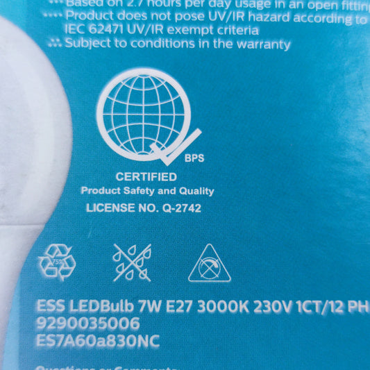 Philips 7W LED bulb E27 warm white packaging showcasing energy efficiency and certification details