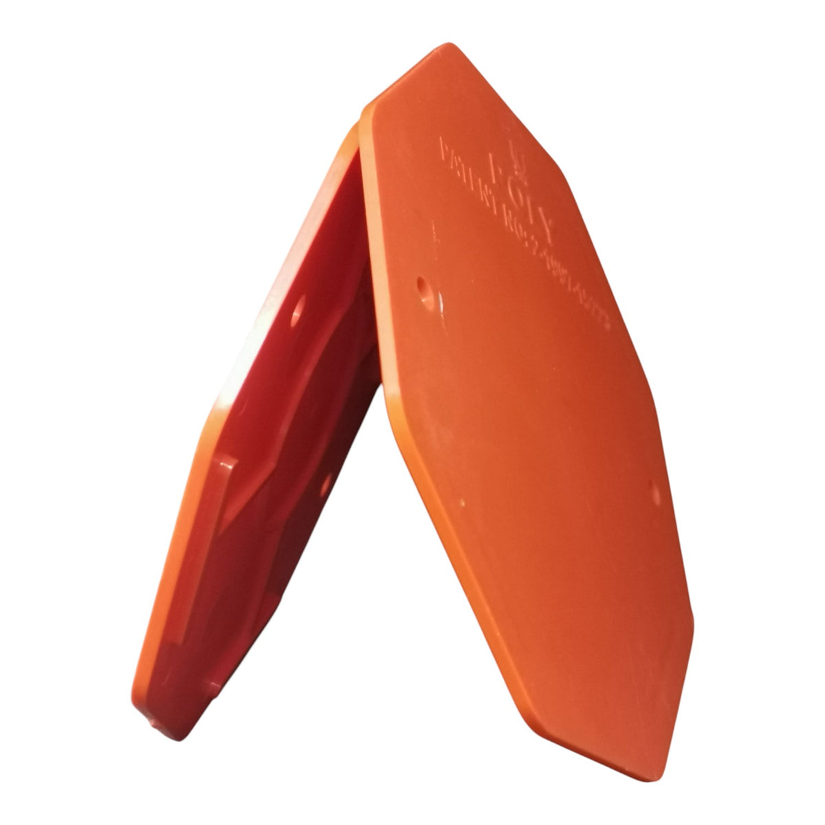 An orange plastic safety barrier block with a hexagonal shape, shown from an angle on a white background.