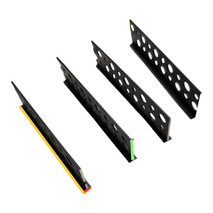Four black metal mounting brackets with circular cutouts, arranged diagonally on a plain white background. One bracket shows a yellow strip with a red end, and one shows a green strip with a red end.