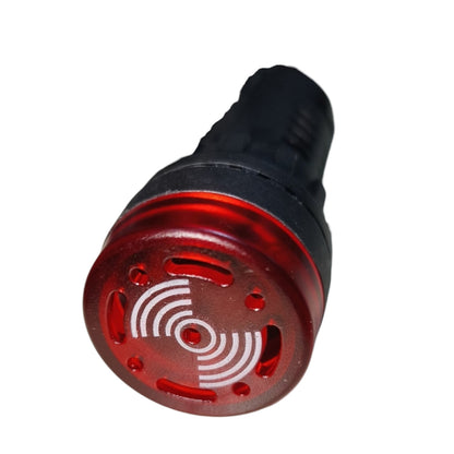 A red and black cylindrical signal light or indicator bulb with a circular white wave symbol printed on the red face, isolated on a white background.