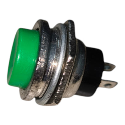A small industrial push-button switch with a bright green button face, a silver metal threaded housing, and a black plastic base with two metal pins, isolated on a white background.