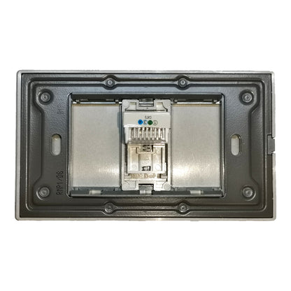 An RJ45 Ethernet port module shown inside its dark gray metal mounting tray, with a silver metal backplate visible behind it.