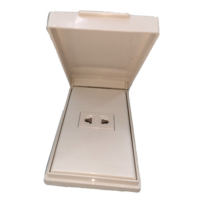 An off-white plastic double outlet socket cover with its lid open, showing two UK-style wall sockets on the front.