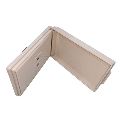 An off-white plastic junction box cover shown open, displaying its interior and the side panel with two screw terminals, isolated on a white background.